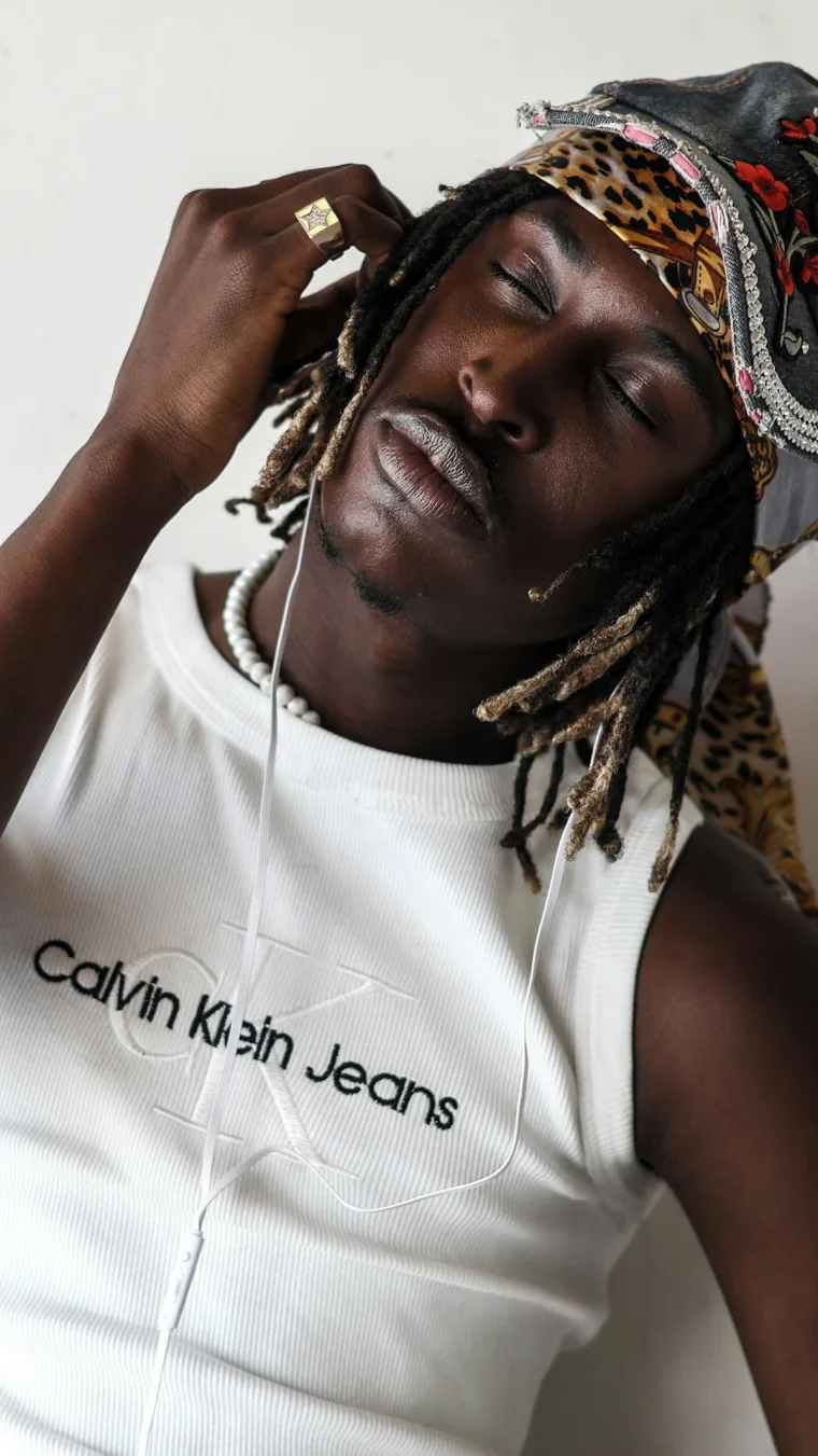 Illustrative stock photo of a person listening with over-ear headphones and closed eyes